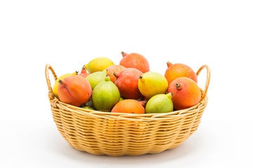 raw betel nut in the basket on white background