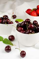 Cherries and Strawberries in the white bowls