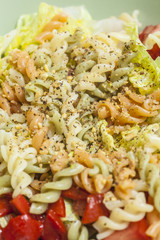 Colorful salad with pasta and variety of vegetables