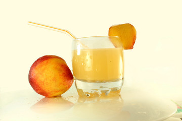 peach and peach juice in white background