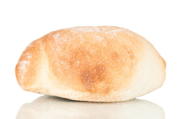 Spanish mollete bread over a reflective background