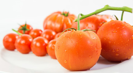 A group of various type and sizes of tomatoes
