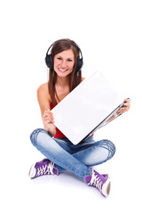 Girl in headphone holding laptop