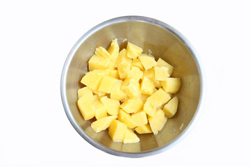 Boiled potato chunk in stainless bowl on white background