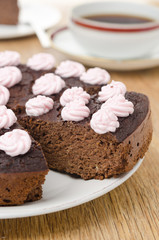 chocolate cake with nuts cut into slices