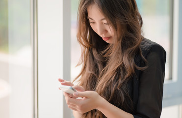 woman uses a smartphone