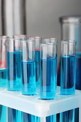 Test-tubes on color background