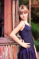Fototapeta premium Charming little girl in a beautiful dress outdoor