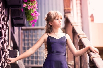 Charming little girl in a beautiful dress outdoor