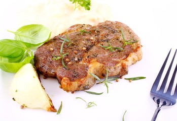 Herb Grilled steak meat with onion, basil and potato