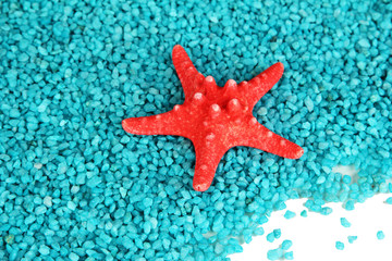 Fototapeta na wymiar Starfish on blue crystals of sea salt background