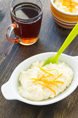 Rice pudding dessert topped with orange peel