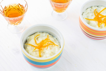 Rice pudding dessert topped with orange peel
