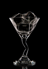 Ice cubes in a glass on a black background