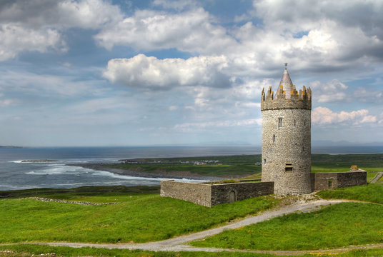 Doonagore castle with cloudy sky
