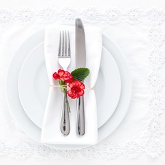 Place setting decorated with carnations