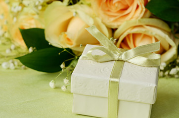 Bouquet of roses and gift box
