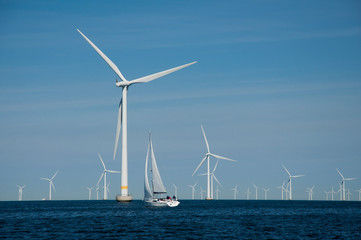 Fototapeta premium Offshore wind farm + yacht