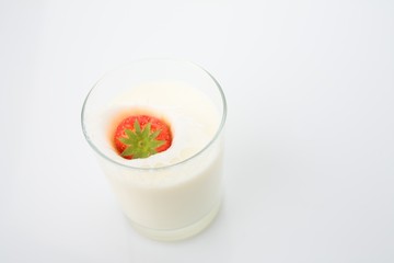 A Strawberry Splashing in Milk