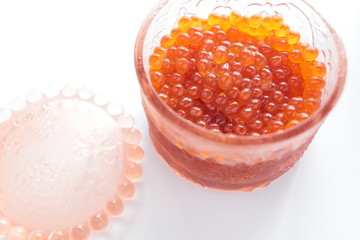  japanese cuisine, seasoned salmon roe Ikura in glass container