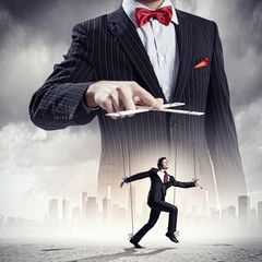 Businessman puppeteer