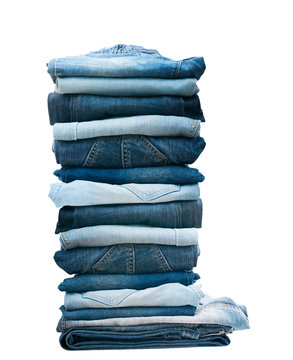 Pile Of Blue Jeans Isolated On White.