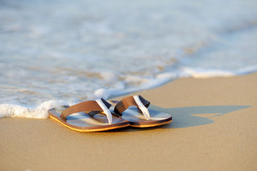 Flip flops on a sandy