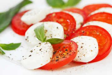 Tomato and mozzarella slices on a plate