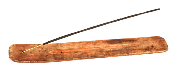 Incense stick in wooden holder