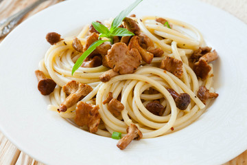 spaghetti with fried mushrooms and basil