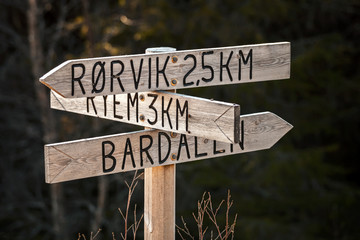 Wooden Road sign with villages names in Norway