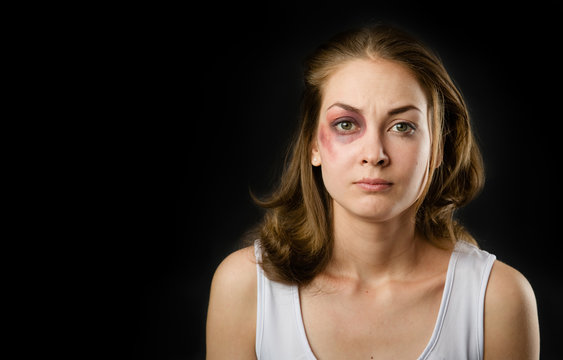 woman victim of domestic violence and abuse. on dark background
