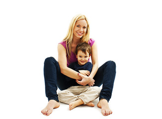 Mother and son in a loving pose on a white background