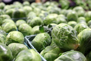 Cartons of fresh brussel sprouts at the market