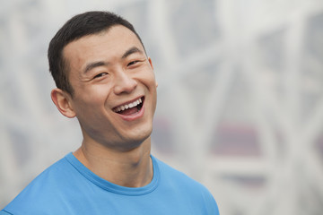 Portrait of young athletic man in Beijing, close-up