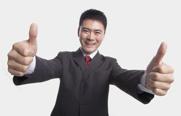 Fototapeta na wymiar Businessman Giving Thumbs-Up