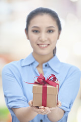 Young Woman Holding Gift Box
