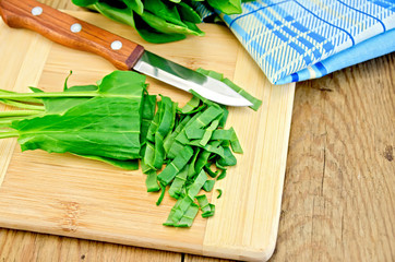 Sorrel cut on a board with a knife and napkin