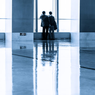 image of People silhouettes at morden office building