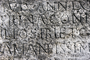 Roman letters stone texture as background