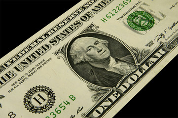 Background from the one-dollar note on a black background