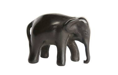 The isolated figurine of an elephant from a tree on a white back