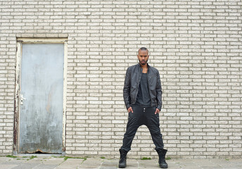 African american fashion model standing in urban environment