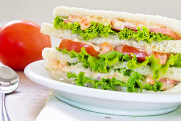 A ham salad sandwich on oat bread