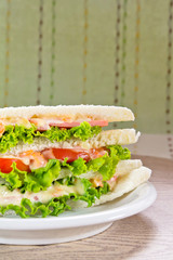 A ham salad sandwich on oat bread