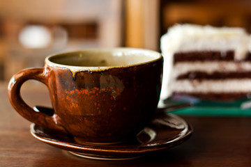 Chocolate cake with a cup of coffee