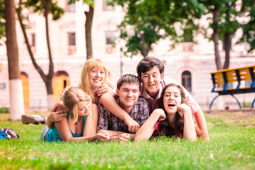 Group of happy smiling Teenage Students Outside