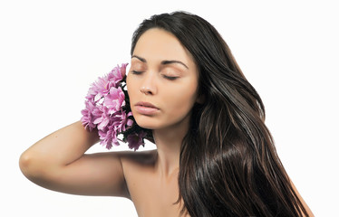 Portrait of young woman with flower