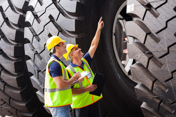 shipping company workers checking industrial tires
