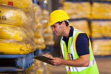 young worker recording rice stock